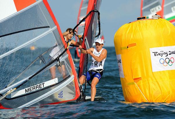 beijing_sensini_4.jpg - Sailboarder Faustine Merret of France pulls her sail out of the water after falling at  the mark in the RS:X women's class in the 2008 Beijing Olympic Games August 11, 2008 in Qingdao, China.  AFP PHOTO/DON EMMERT (Photo credit should read DON EMMERT/AFP/Getty Images)